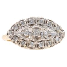 an antique diamond ring with two rows of diamonds in the middle and one row of stones on