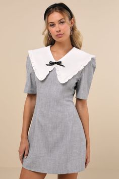 Sophisticated and playful at the same time, the Sister Jane Heron Heather Grey Bow Oversized Collar Short Sleeve Mini Dress is our new fave find! Midweight woven fabric boasts a heathered effect as it shapes short sleeves and a fitted bodice that features an oversized, statement collar with ruffled trim and a removable beaded bow detail. Fit-and-flare silhouette falls to a mini hem. Hidden zipper at back. Fit: This garment fits true to size. Length: Mid-thigh. Size uk m/us 6 measures 33.5" from shoulder to hem. Bust: Great for any cup size. Waist: Fitted - very fitted at natural waist. Hip: Not Fitted - fuller skirt allows room for hips. Undergarments: May be worn with any standard bra. Fabric: Fabric has no stretch. Lined. Shell: 65% Polyester, 30% Viscose, 5% Elastane. Contrast: 95% Poly Spring Workwear Dresses With Peter Pan Collar, Chic Peter Pan Collar Dress For Spring, Chic Dress With Peter Pan Collar For Spring, Chic Collared Dress For Daywear, Elegant Summer Dress With Peter Pan Collar, Elegant Summer Dresses With Peter Pan Collar, Summer Formal Dress With Peter Pan Collar, Grey Mini Dress, Collar Mini Dress