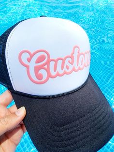 Super fun trucker hats that can be customized with your team name, mascot, phrase and more!   They are created with puff embossed print and look fantastic in our huge assortment of puff colors. Hat Colors:  All Black, All White, Black Back with White Front, Khaki Closure: The back is an adjustable snap back Please List: 1. Text Style ( Script or Athletic Font Shown) ** please reach out first if you have a custom text or logo. 2. Text on Hat (8-10 characters) ** the more characters there are the Novelty Snapback Hat With Letter Print And Curved Brim, Novelty Snapback Baseball Cap With Letter Print, Novelty Trucker Hat With Letter Print And Flat Bill, Customizable Novelty Trucker Hat, Novelty Letter Print Snapback Baseball Cap, Customizable Black Custom Snapback Hat, Novelty Customizable Trucker Hat, Customizable Black Snapback Hat, Novelty Letter Print Snapback Hat