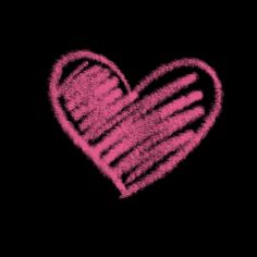 a pink heart drawn in chalk on a black background