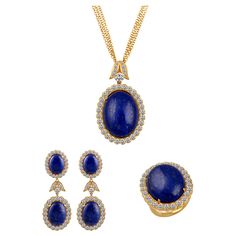 Approximately 15 Ct Diamond & 30+ Ct Natural Lapis Lazuli Set in 18 Karat Yellow Gold. Set Includes a Ring, a Earring, and a Pendant with three layer chain . Made in Italy. Ring size 5.5 This spectacular set consisting of Natural Lapis Lazuli includes Four pieces . Pendant , Ring , Earring Comes with a Three layer Chain in yellow gold Chain is 16 inch long in yellow gold Very nice set ! 18 K gold 74.5 Grams with stone. All Lapis are surrounded by brilliant cut round diamonds of Very good quality Formal Round Gemstone Jewelry Sets, Luxury Gemstone Jewelry Sets For Formal Occasions, Formal Yellow Gold Jewelry Sets With Gemstones, Formal Yellow Gold Gemstone Jewelry Sets, Luxury Yellow Gold Jewelry Set For Anniversary, Luxury Hand Set Oval Jewelry, Luxury Oval Hand-set Jewelry, Luxury Hand-set Oval Jewelry, Formal Hallmarked Yellow Gold Jewelry Sets