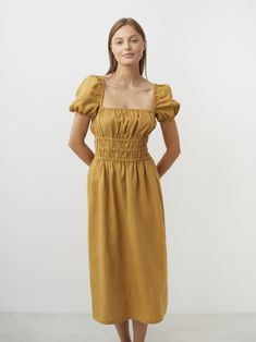 "HOLIDAY is an elegant puff short sleeves linen midi dress.  DETAILS - Puff short sleeves with elastic hem - Square neckline - Shirred waist - Midi length - Oeko-Tex certified 100% local washed midweight linen - Cut and sewn to order just for you in our studio COLOR - Yellow Honey, you can also choose other colors above - Fabric samples are available here https://www.etsy.com/listing/586569696/linen-fabric-samples SIZING & FIT - Fit true to size - Model is 5'10\" / 178cm and wearing a size S CAR Short Sleeve Dresses With Elastic Shoulders For Brunch, Linen Short Sleeve Midi Dress For Brunch, Linen Midi Dress With Short Sleeves For Brunch, Daywear Puff Sleeve Dress With Smocked Back, Puff Sleeve Dress With Gathered Short Sleeves, Linen Puff Sleeve Dress For Daywear, Short Sleeve Midi Dress With Elastic Sleeves For Daywear, Summer Puff Sleeve Dress With Gathered Waist, Summer Puff Sleeve Dress With Elastic Shoulders