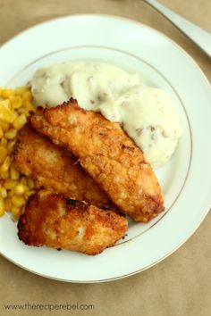 fried chicken with corn on the cob and mashed potatoes