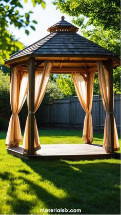 Wooden gazebo with draped curtains in a sunny backyard.