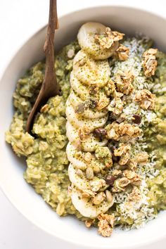 a white bowl filled with bananas and pesto