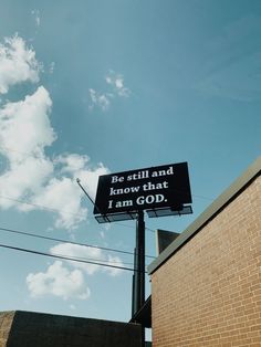 a sign that says be still and know that i am god on the side of a building