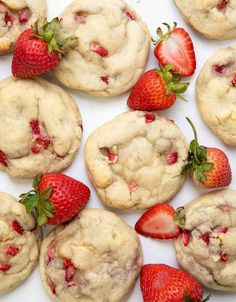 strawberry muffins with white chocolate chips and fresh strawberries on the top one