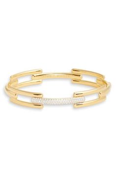 Link-inspired bars give sleek structure to a sterling silver bangle plated in 18-karat gold and lit up with lab-created diamond pavé. Exclusive US retailer Small=6”, Medium=6 1/2” inner circumference; 3/8" width Total lab-created diamond weight: 0.37–0.43ct. Clarity: VS Sterling silver/18k-gold plate/lab-created diamond Imported >Diamond Guide Modern Diamond Bracelet With Pave Setting, Elegant Gold Cuff Bracelet With Pave Setting, Modern Gold Cuff Bracelet With Diamond Accents, Modern Gold Bangle With Pave Setting, Modern Gold Bracelet With Pave Setting, Monica Vinader, Diamond Guide, Diamond Bangle, Sterling Silver Bangles