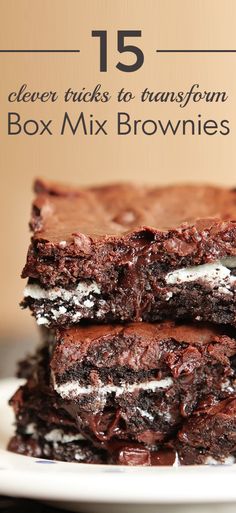 two brownies stacked on top of each other with oreo and cream in the middle