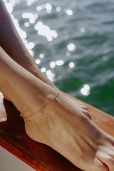 Step into a world of beachside bliss with our Seaside Charm Anklet. This enchanting anklet combines coastal charm with elegant details, creating a piece that celebrates the serene beauty of the sea and adds a touch of sophistication to your style. 14k yellow gold worn at 9 or 10 inches Charm Anklet, Coastal Charm, A World, Anklets, Your Style, The Sea, Yellow Gold, Celebrities, Yellow