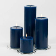 three blue candles sitting next to each other on a white surface with the words quick candles written below them