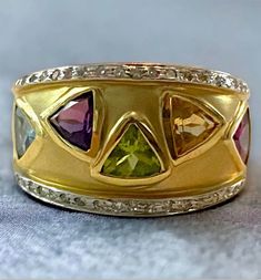 Vintage 14K Yellow Gold Wide Statement Multi Color Gemstones Diamond Ring Size 8 Gorgeous vintage ring! * Hallmarked SNB 14K, this solid 14k yellow gold ring with all natural multi stones and small diamonds is sure to please! * Beautiful designed ring and perfect gift for any special occasion! * Weighs 8.6 grams * Size 8 Please message me with any questions Shipped FAST and FREE, fully insured and in a gift box :) I guarantee item to be exactly as described and pictured. Yellow Multi-stone 14k Gold Rings, Seed Pearl Ring, Gemstone Diamond Ring, Gold Gift, Pretty Rings, Yellow Gold Ring, Multi Stone Ring, Vintage Ring, Multi Stone