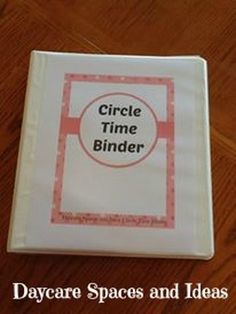 a close up of a book on a wooden floor with the title circle time binder