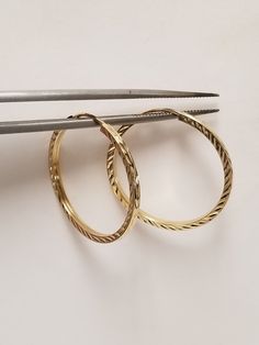 "Thanks for shopping our vintage estate store. We tend to sell well below wholesale and truly hope you enjoy all of our items. Many of the items are one of a kind, so please enjoy scrolling through the pictures and hopefully something will catch your eye. Brown spots are from camera or reflections. Beautiful estate 14k yellow gold mediu diamond cut square tube endless hoops. Bought out a jewelry store that was closing and these were in their inventory. They are new. Size: 25mm 1\" Width: 1.5mm Weight: 1.07 grams Nice  hoops, some that you will love. Marked 14k." Anniversary Yellow Gold Hinged Hoop Earrings, Heirloom Hoop Jewelry For Anniversary, Small Hoop Engraved Yellow Gold Earrings, Engraved Small Hoop Earrings In Yellow Gold, Small Hoop Yellow Gold Anniversary Rings, Small Hoop Yellow Gold Rings For Anniversary, 14k Gold Diamond Cut Hoop Earrings For Anniversary, Classic Yellow Gold Hoop Earrings Stamped 14k, Classic 14k Stamped Hoop Jewelry