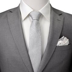 Un diseño floral blanco hermoso pero masculino crea el patrón sutil en esta corbata de hombre gris.  Nuestra corbata mantendrá su forma y mantendrá un nudo perfecto gracias a la duradera y suave 100% Seda.  Un accesorio perfecto que se puede usar para eventos formales u ocasiones especiales.  Pares bien con nuestro cuadrado de bolsillo floral gris suave. Classic Gray Suit And Tie Accessories For Wedding, Classic Silver Tie For Groom, White Pocket Square For Business Suit, White Pocket Square For Business Suit Accessories, Classic Silver Suit And Tie Accessories For Grooms, White Business Ties With Pocket Square, Elegant White Tie With Pocket Square, White Pocket Square For Black Tie Events, Elegant White Tie For Groom