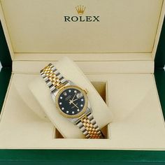 Women's Midsize Rolex 18K Gold Two Tone 31mm DateJust Watch with Black Diamond Dial and Fluted Bezel. Pre-Owned Brand: Rolex. Bezel: Fluted. Dial: Diamond. Dial Color: Black. Crystal: Sapphire. Condition: Good. Gender: Women's. Dial: Diamond Dial. Case Dimensions: 31mm Midsize. Movement: Self-Winding (Automatic). Metal Type: 18K Yellow Gold / Stainless Steel. Bracelet / Strap: Jubilee 18K Gold / Stainless Steel. Box / Certificate: Rolex Box / Certificate of Authenticity. Service Warranty: One (1 Rolex Ring Women, Datejust 36mm Woman, Vintage Rolex Women, Rolex Datejust 31 Women, Rolex Womens, Rolex Datejust Women, Custom Gold Jewelry, Rolex Watches Women, Rolex Women