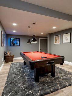 a pool table in the middle of a room