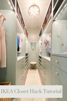 a walk in closet with lots of drawers and clothes hanging on the wall above it