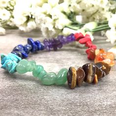 ✦Gemstone: Coral, Amethyst, Aventurine jade, Carnelian, Lapis, Tiger's eye, Blue Turquoise ✦Color: Red, Orange, Yellow, Green, Blue, Purple ✦Shape: Chips ✦Wrist size: 5''-7'' ✦QTY: 1 pc / package Please measure your wrist size, then order the bracelet. Charoite is here to bring the light. Splashed with purple potency, this stone is all about positive transformation. For clean slate thinking and welcoming great chance into your life, it's important to let go of negative energy and to practice bei Healing Rainbow Natural Stone Bracelets, Spiritual Multicolor Handmade Crystal Bracelet, Handmade Multicolor Crystal Spiritual Bracelet, Gemstone Chips Bracelet, Adjustable Multicolor Multi-stone Crystal Bracelet, Multicolor Multi-stone Spiritual Bracelets, Reiki Jewelry, Rainbow Gemstones, Spiritual Crystals