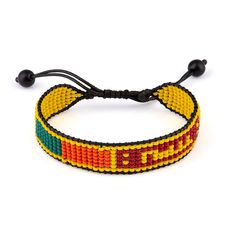 Celebrate your love for Sri Lanka with this stylish and meaningful beaded bracelet. Crafted with care, this boho rope bracelet features vibrant beads in the colors of the Sri Lankan flag, beautifully woven onto an adjustable thread string. Perfect for both women and men, this accessory is a versatile and fashionable way to showcase your cultural pride or appreciation for the island nation. With its adjustable design, it can comfortably fit most wrist sizes, making it a great choice for everyday wear or special occasions. Whether youre a Sri Lankan native, have ties to the country, or simply admire its rich heritage, this bracelet is a charming and eye-catching addition to your jewelry collection. Embrace the spirit of Sri Lanka and let this bohemian-inspired piece add a touch of vibrant fl Sri Lanka Flag, Flag Beads, Boho Stil, Sri Lanka, Rope Bracelet, Boho Fashion, Jewelry Collection, Jewelry Bracelets, Flag