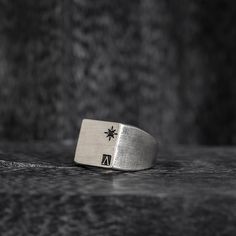 Introducing the Oval Signet Ring - a reworked design that exudes elegance and sophistication. This ring features the iconic message ____ engraved around the crown, serving as a reminder of the wearer's triumphs and accomplishments. Crafted in the classic signet ring style, this piece is a timeless addition to any jewelry collection. The oval shape adds a modern touch, while the intricate details showcase the expert craftsmanship. With its meaningful message and beautiful design, this ring is perfect for those who want to make a statement and leave a lasting impression. "All conditioned things are Impermanent."-Sterling silver 925.-Size: 20mm by 15mm. Thickness 1-2mm.-Engraved around the crown. Specifications -Signet Ring style, reworked design. -Sterling silver 925. -Size: 20mm by 15mm. Th Classic Formal Rings With Engraved Logo, Elegant Formal Ring With Engraved Logo, Elegant Formal Rings With Engraved Logo, Elegant Engraved Logo Ring For Formal Occasions, Luxury Silver Jewelry With Engraved Logo, Classic Anniversary Jewelry With Engraved Logo, Elegant Silver Jewelry With Engraved Logo, Classic Ring With Engraved Logo, Classic Jewelry Ring With Engraved Logo