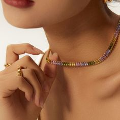 Introducing our exquisite 18k Gold Plated Non-Tarnish Multicolor Necklace, the epitome of modern sophistication and cool elegance. Crafted with meticulous attention to detail, this necklace features a stunning array of vibrant zirconia stones in a rainbow of colors, set against a backdrop of luxurious 18k gold plating. This chic choker necklace is designed to add a pop of color and a touch of whimsy to any outfit, whether you're dressing up for a night out or adding flair to your everyday look. Colorful Choker, Multicolor Necklace, Bridesmaid Gifts Jewelry, Rainbow Necklace, Unisex Necklace, Modern Necklaces, Tennis Necklace, Bridesmaids Gifts, Necklace Chain