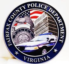 a police car is parked in front of the virginia county police department logo on a wall