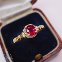 a close up of a ring in a box