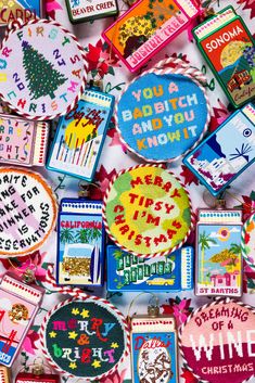 many different types of embroidered badges on display