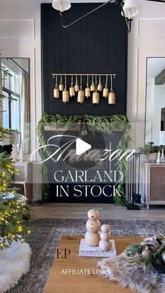 a living room decorated for christmas with garland and decorations on the fireplace mantels