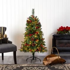 a small christmas tree in a living room with presents on the floor and other decorations