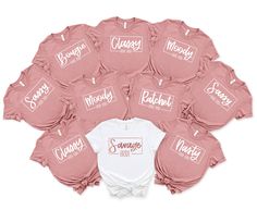 a bunch of pink onesuits with names on them