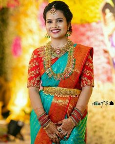 a woman in a blue and orange sari