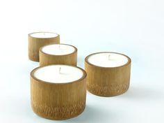 three wooden candles sitting next to each other