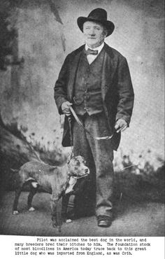 an old black and white photo of a man standing next to a dog with a hat on