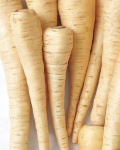 some very pretty looking carrots on a white surface