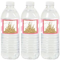 three water bottles with pink and gold glitters on the top, one is empty