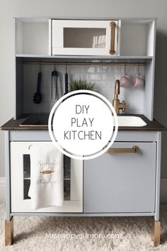 the diy play kitchen is made from an old cabinet