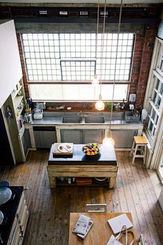 an overhead view of a kitchen with wooden floors