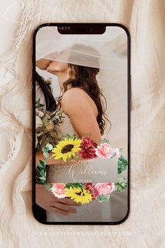 an iphone case with a photo of a bride and groom on the back, surrounded by flowers