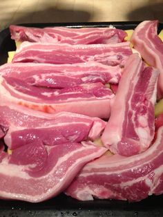 raw meat in a tray ready to be cooked and put into the oven for cooking