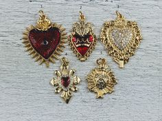 Love these new charms 18k gold plating over brass red epoxy heart on some of them evil eye and royal crown  cz crystals jump ring at top listing is for 1 charm lead, nickel and cadmium free measure from 26-32x14-26mm if you need the exact size of a particular charm please convo me Red Heart-shaped Charm Jewelry, Red Charms For Valentine's Day, Red Charms For Valentine's Day Gift, Red Valentine's Day Gift Charms, Gold Heart Charm For Valentine's Day, Gold Heart Charms For Valentine's Day, Valentine's Day Gold Heart Charm, King And Queen Of Hearts, Prom King And Queen