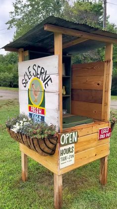 an outdoor chicken coop with signs on it