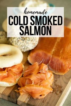 homemade cold smoked salmon on a cutting board with bagels and donuts in the background