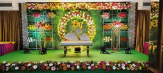 the stage is decorated with flowers and candles