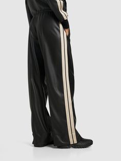 Elastic waistband. Front logo detail. Two side pockets. Model is wearing a sizeS Track Pants Women, Heeled Rain Boots, High Heel Rain Boots, Shoe Boot Sandals, Backpack Tote Bag, Palm Angels, Dress With Boots, Track Pants, Women's Pants