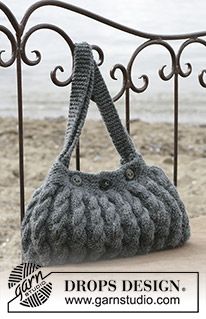 a purse is sitting on top of a bench