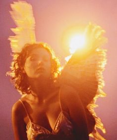 a woman with her hair blowing in the wind