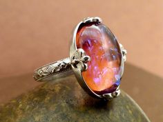 Handmade antiqued 925 sterling silver ring with beautiful vintage glass dragon's breath opal color stone sets on top.  Measurement,  Front measures 0.9 inch (23mm) by 0.7 inch (18mm). Dragons Breath Fire Opal, Dragons Breath Opal, Galaxy Ring, Dragons Breath, Universe Galaxy, Fire Opal Ring, Silver Dragon, Opal Color, Color Stone