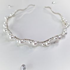 We only use the highest quality materials for our accessories for long-lasting wear, which makes them the perfect choice. --- What's included --- High-quality glass pearls and AB crystal beads hand wrapped with jewellery wire to a silver colour metal headband. Custom orders taken, please message to discuss. Headband Pearl, Pearl Hair Accessories Head Bands, White Beaded Headband Jewelry, Silver Pearl Headband, Thick Pearl Headband, Bride Headband, Metal Headbands, Beaded Headband, Pearl Headband